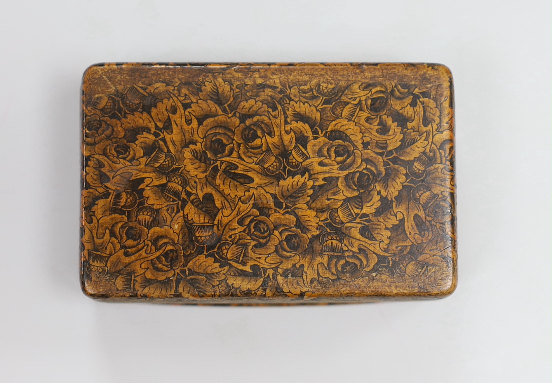 A 19th century mauchline ware penwork snuff box, depicting a rent collector in an interior and inscribed verse, 8cm wide
